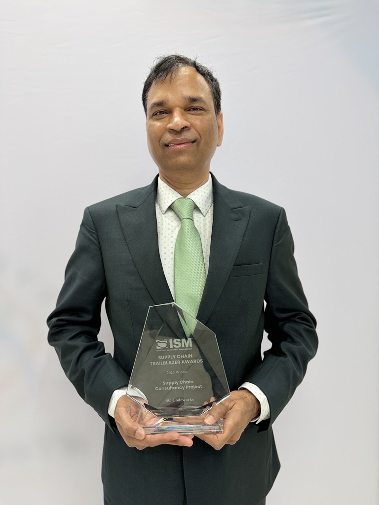 Suresh Chappidi, President and CEO of SC Codeworks, holding the ISM 2025 Supply Chain Trailblazer Award trophy for Supply Chain Consultancy Project